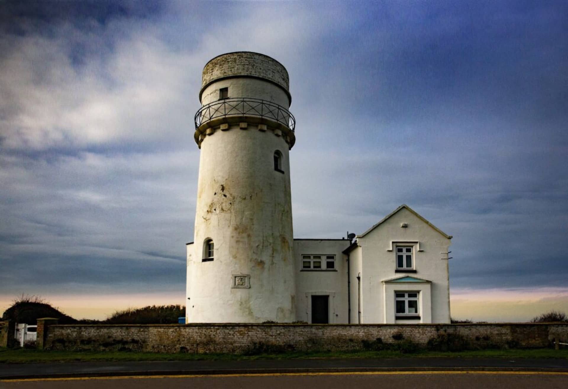 The Old Hunstanton Lighthouse under a cloudy sky during the sunset on a cloudy evening in Norfolk England