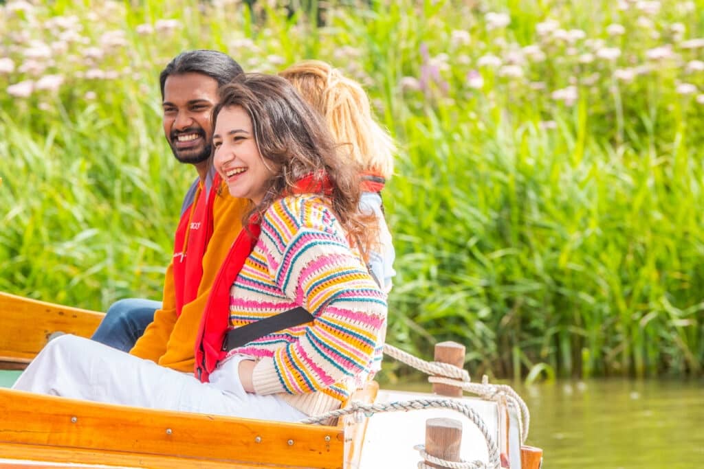 Young people smiling on boat cruise