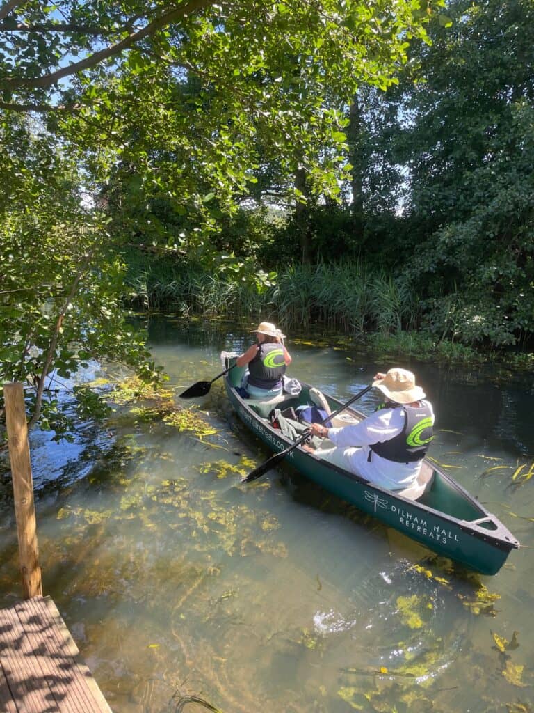 Two people paddling in a canoe