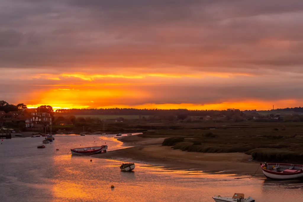 Low sunset over the River Burn at Burnham Overy Staithe