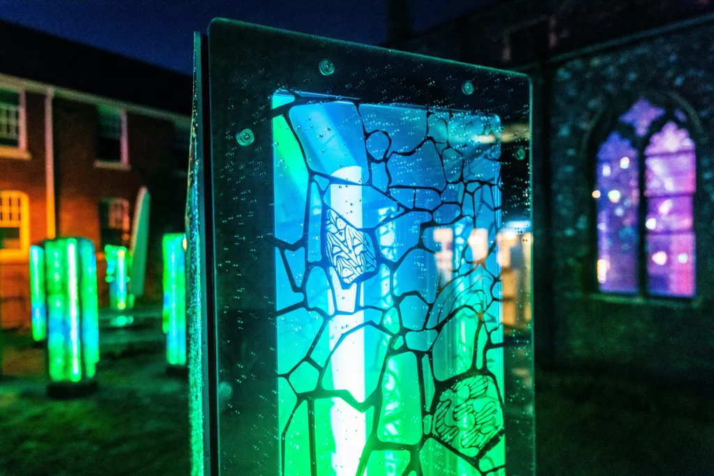 Close up of art installation lit green