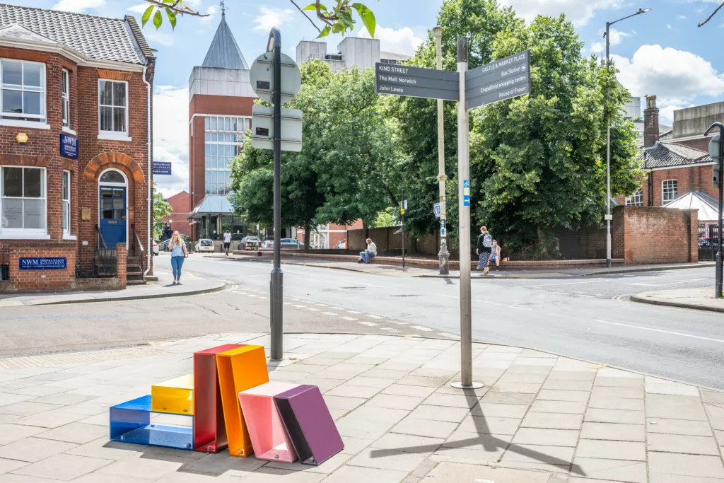 Colourful bench with the likeness of books on a bookcase on Surrey St, Norwich