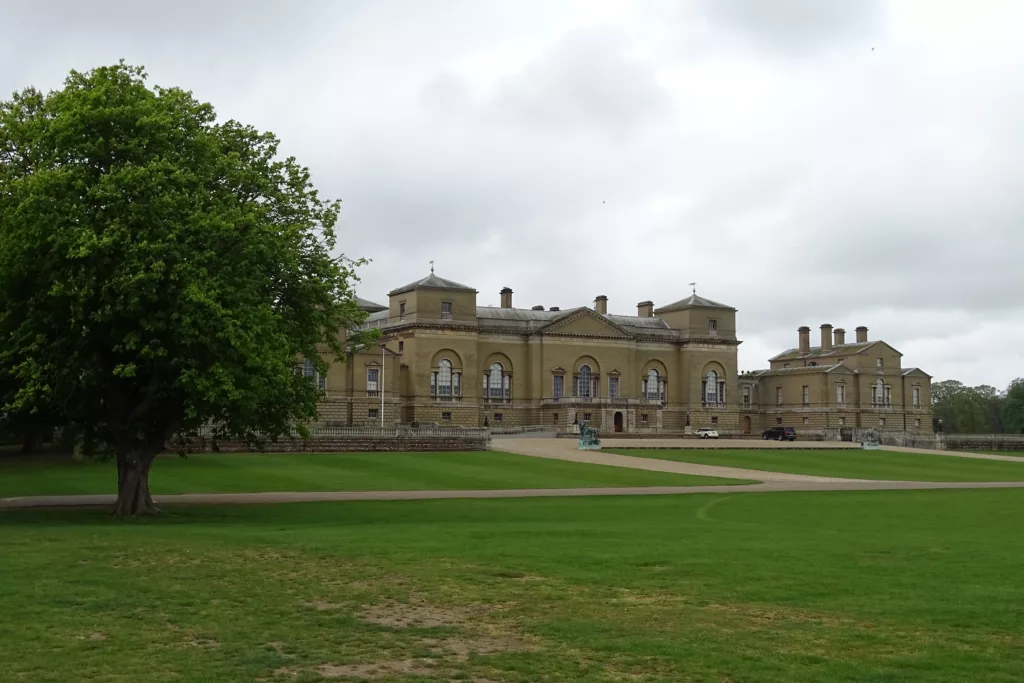 A wide shot of Holkham Hall on a cloudy day